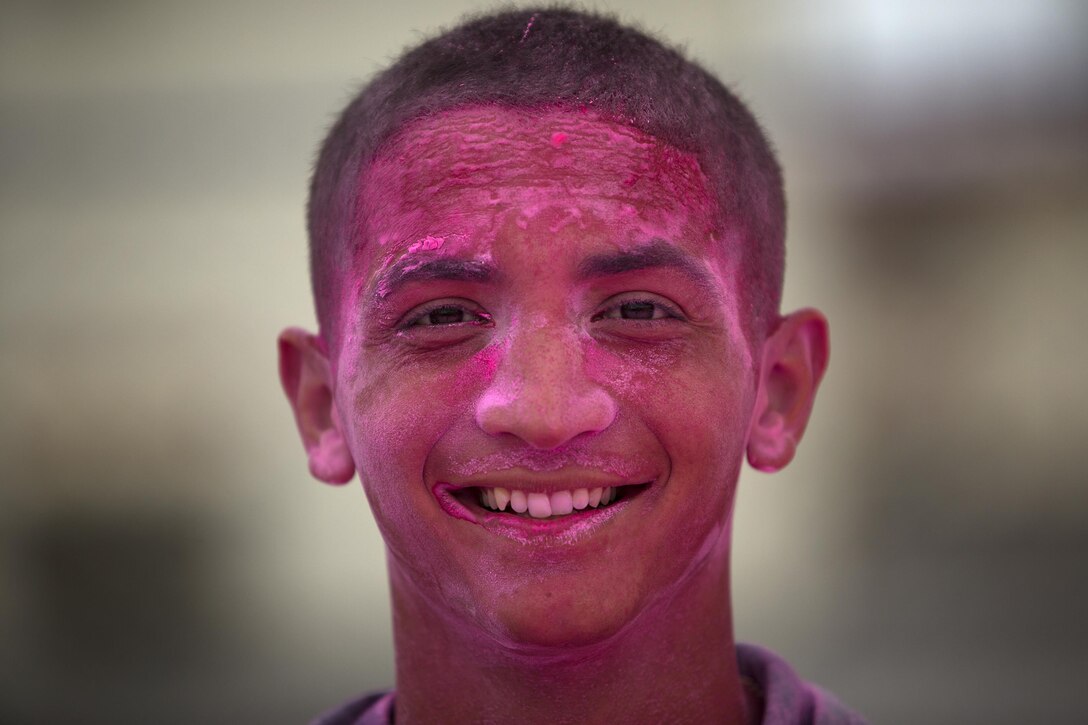 Cpl. Jonathan Mercado poses for a photo during the Color Me Fun 5k Run May 23 on Camp Foster, Okinawa, Japan. Mercado was one of many volunteers who manned color stations along the 5k run. Each station had barrels of different colored powder volunteers would toss at passing runners. Mercado is a Buffalo, N.Y. native, and motor transport operator with 3rd Medical Battalion, 3rd Marine Logistics Group, III Marine Expeditionary Force. (U.S. Marine Corps photo by Sgt. Matthew Callahan/Released)