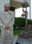 New York Army National Guard Command Sgt. Major Louis Wilson views the New York National Guard's monument to fallen Guardsmen outside New York Division of Military and Naval Affairs headquarters in Latham, New York, on May 19, 2015. Wilson will represent Sgt. Henry Johnson, a World War I Soldier slated to receive a posthumous Medal of Honor during a White House Ceremony on June 2, 2015.