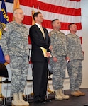 Army Maj. Gen. Raymond Rees, the adjutant general, Oregon (left), stands with Oregon Attorney General John Kroger, 41st Infantry Brigade Combat Team commander Army Col. Eric Bush, and 2nd Battalion, 162nd Infantry Regiment commander Army Lt. Col. Eric Riley, during a ceremony honoring soldiers of 2nd Platoon, Bravo Company, 2-162 IN BN, where they were awarded the Presidential Unit Citation at the Corvallis Armory, Jan. 8. The soldiers received the award for their heroic actions during the Battle of Fallujah, Iraq in November 2004.