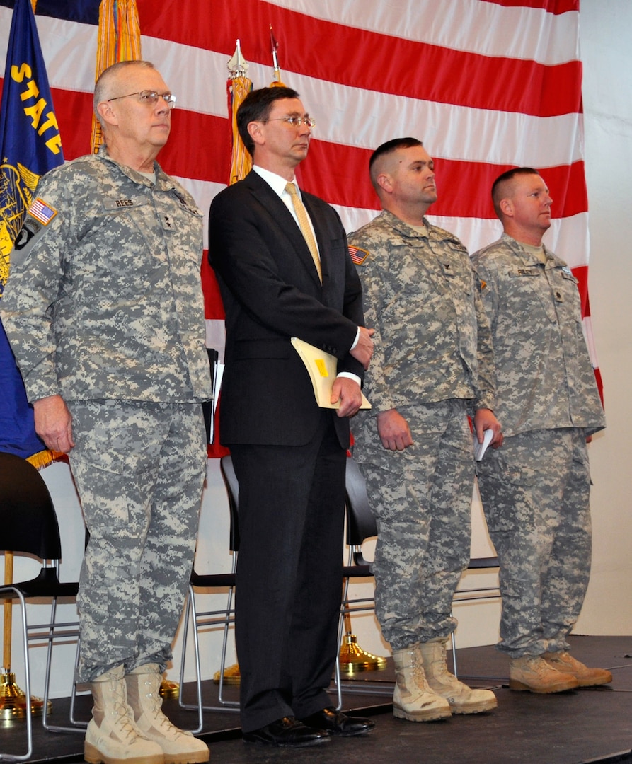 Army Maj. Gen. Raymond Rees, the adjutant general, Oregon (left), stands with Oregon Attorney General John Kroger, 41st Infantry Brigade Combat Team commander Army Col. Eric Bush, and 2nd Battalion, 162nd Infantry Regiment commander Army Lt. Col. Eric Riley, during a ceremony honoring soldiers of 2nd Platoon, Bravo Company, 2-162 IN BN, where they were awarded the Presidential Unit Citation at the Corvallis Armory, Jan. 8. The soldiers received the award for their heroic actions during the Battle of Fallujah, Iraq in November 2004.