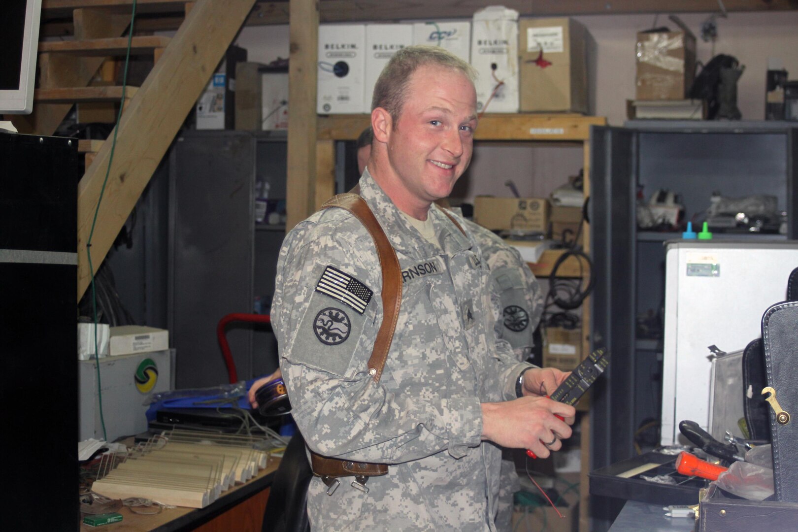 Oregon Army National Guard Sgt. Alan Arnson, a member of the 3rd Battalion, 116th Cavalry Regiment, 3rd Sustainment Brigade, 103rd Sustainment Command (Expeditionary), works on radio equipment at Joint Base Balad, Iraq. Arnson stepped into the No. 2 slot in the battalion’s communications section just before he deployed to Iraq.