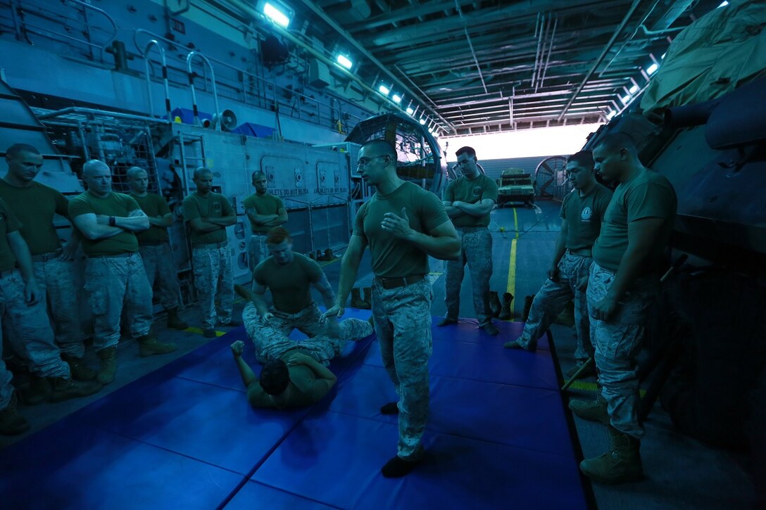 U.S. Marines learn different techniques during Marine Corps Martial Arts Program training aboard the USS Anchorage (LPD 23) at sea in the Pacific Ocean, May 24, 2015. The Marines and Sailors aboard the Anchorage train constantly to prepare for their next assignment while deployed. (U.S. Marine Corps photo by Sgt. Jamean Berry/Released)
