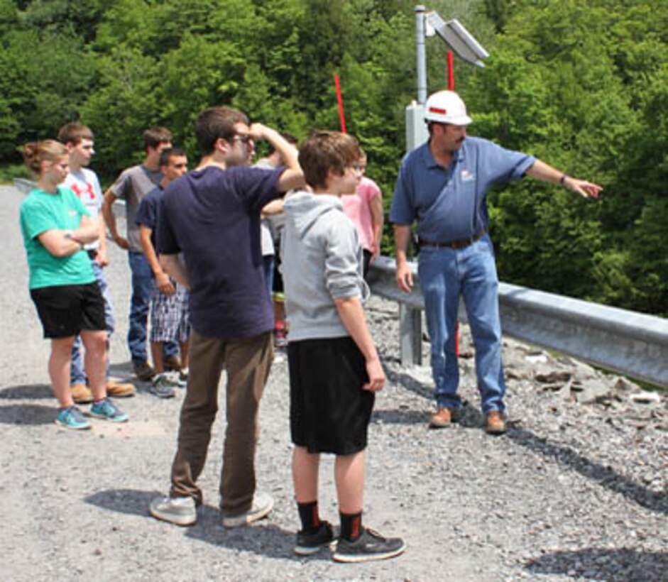 USACE Philadelphia District Dam & Levee Safety Program Manager Bruce Rogers conducts a tour with students from the Wallenpaupack High School Emergency Responders Club during a dam safety awareness event in May of 2015. 