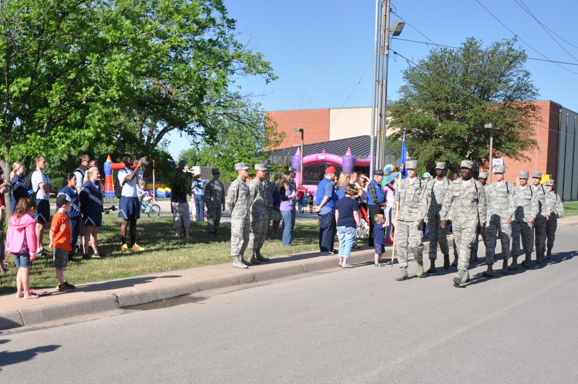 GOODFELLOW AIR FORCE BASE, Texas – Several 17th Training Group students perform a drill exercise during the Month of the Military Child "What's Your Story" Children's Fair at the youth complex April 25. The event featured bounce houses, games and activities for Goodfellow youth. (U.S. Air Force photo/ Senior Airman Joshua Edwards)