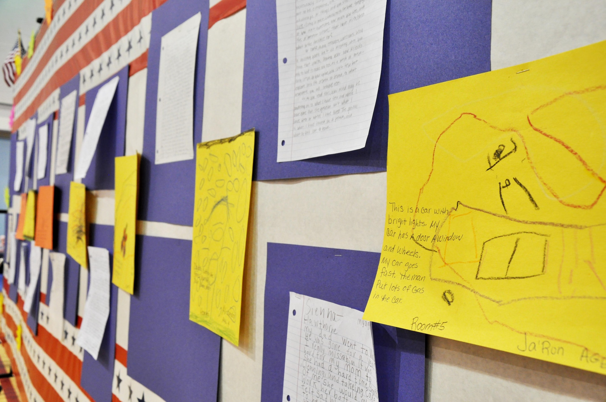 GOODFELLOW AIR FORCE BASE, Texas – The “What’s Your Story” essay contests entries are displayed during the Month of the Military Child "What's Your Story" Children's Fair at the youth complex April 25. The essay contest was broken down into five age groups and featured the children’s perspective of the military lifestyle. (U.S. Air Force photo/ Senior Airman Joshua Edwards)