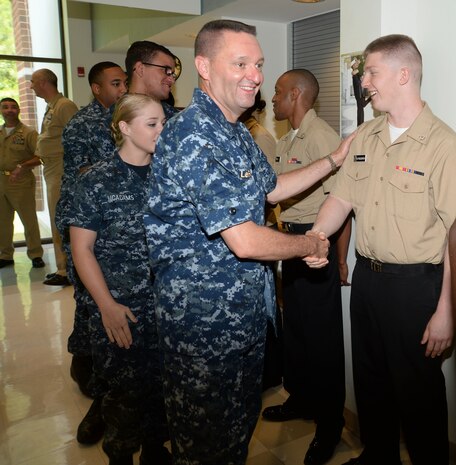 Capt. John LeFavor, commanding officer, Naval Hospital Jacksonville, Florida, congratulates sailors during a frocking ceremony at Naval Branch Health Clinic Albany located at Marine Corps Logistics Base Albany, May 28. HM2 Ricky Cuevas, HM3 Cholee Ward, HM3 Nicholas Gilchrist, HN Aundrea Maddox, HN Roderick Frederick and HN Benjamin Rozeboom will receive their official promotions at various intervals over the next several months.