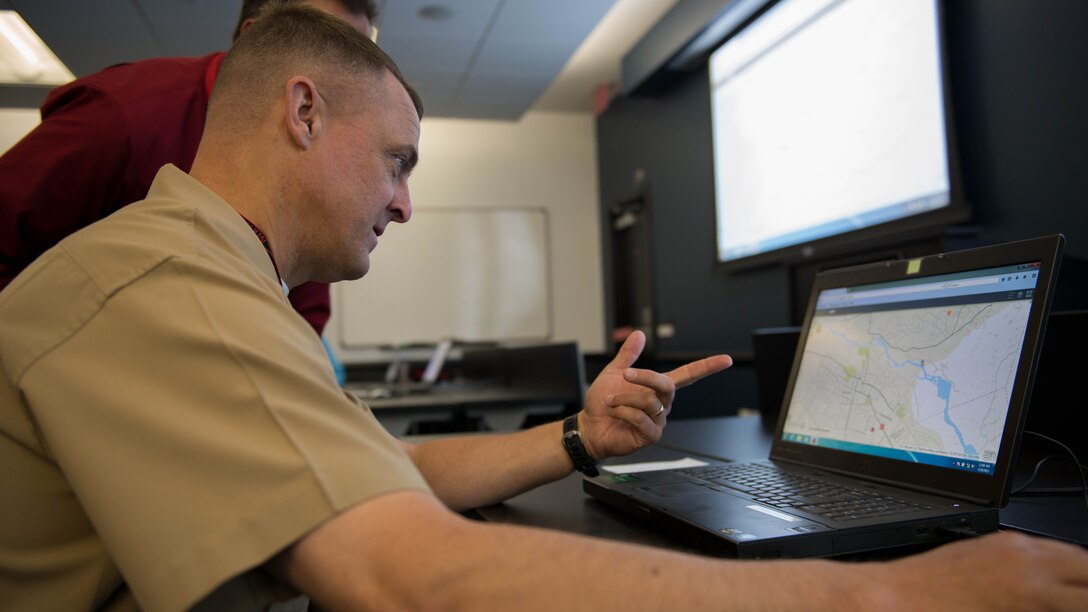 Staff Sgt. Joel Crenshaw, a cohort with the Accelerator team tests out the new Tellus program before the presentation hosted by Mantech Spaces in Stafford Va., May 29, 2015 .  Tellus is a program that uses modern technology to view the entire battlefield in real-time.