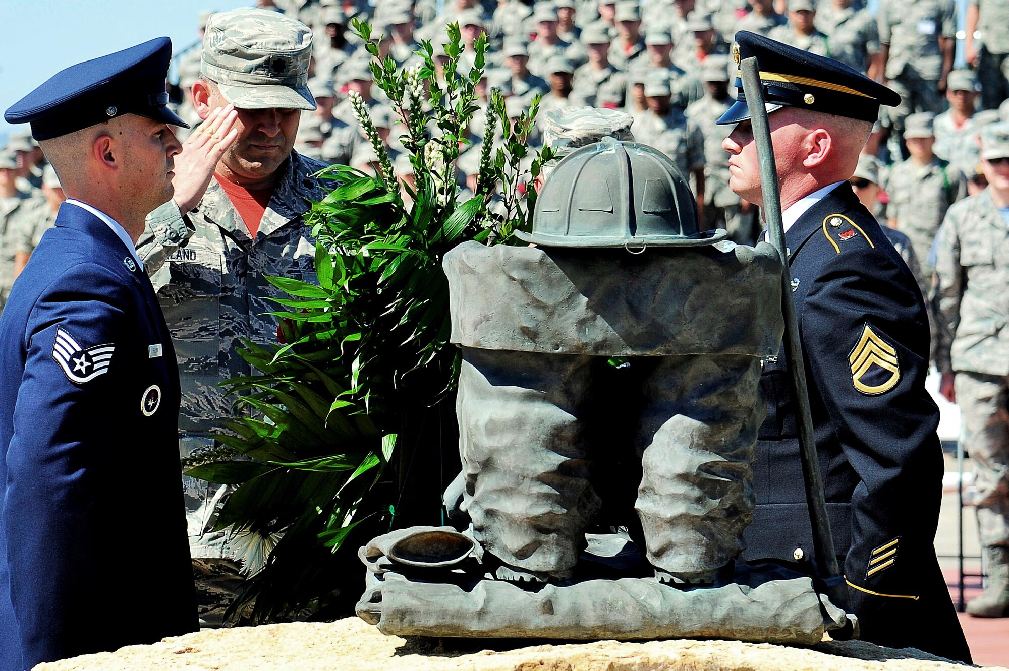 U.S. Air Force Lt. Col. Derek Ferland, 312th Training Squadron Commander, salutes after the placing of the wreath at the Department of Defense Fallen Firefighters’ Memorial on Goodfellow Air Force Base, Texas, May 1, 2015. This year’s addition to the memorial was Battalion Chief John McDonald, DOD firefighter, who died in the line of duty. (U.S. Air Force photo by Tech. Sgt. Austin Knox/Released)