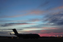 A C-17 Globemaster from Charleston Air Force Base, S.C. sits on the flightline, May 27, 2015, from Hurlburt Field, Fla.  The C-17 was loaded with 823rd RED HORSE members and medical vehicles and took off in support of NEW HORIZONS 2015, an annual event conducted to train military civil engineers and medical professionals to deploy and conduct joint operations. (U.S. Air Force photo by Airman 1st Class Ryan Conroy/Released)  
