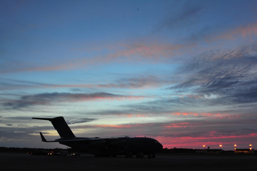 A C-17 Globemaster from Charleston Air Force Base, S.C. sits on the flightline, May 27, 2015, from Hurlburt Field, Fla.  The C-17 was loaded with 823rd RED HORSE members and medical vehicles and took off in support of NEW HORIZONS 2015, an annual event conducted to train military civil engineers and medical professionals to deploy and conduct joint operations. (U.S. Air Force photo by Airman 1st Class Ryan Conroy/Released)  
