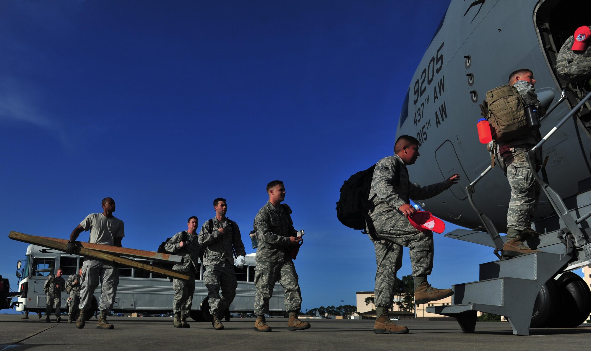 Members of the 823rd RED HORSE board a C-17 Globemaster, May 27, 2015, at Hurlburt Field, Fla. Twelfth Air Force, in conjunction with the U.S. Embassy and government of Honduras, is currently conducting NEW HORIZONS 2015, an annual event conducted to train military civil engineers and medical professionals to deploy and conduct joint operations. (U.S. Air Force photo by Airman 1st Class Ryan Conroy/Released)  
