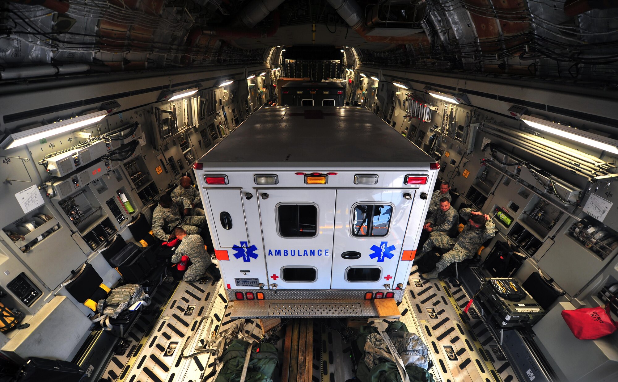 Members of the 823rd RED HORSE prepare for takeoff on a C-17 Globemaster, May 27, 2015, at Hurlburt Field, Fla. The unit deployed in support of NEW HORIZONS 2015, a joint training-readiness exercise conducted in Honduras to improve the readiness of U.S. and partner nation civil engineers, medical professionals and support personnel through humanitarian assistance activities. (U.S. Air Force photo by Airman 1st Class Ryan Conroy/Released) 

