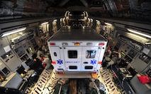 Members of the 823rd RED HORSE prepare for takeoff on a C-17 Globemaster, May 27, 2015, at Hurlburt Field, Fla. The unit deployed in support of NEW HORIZONS 2015, a joint training-readiness exercise conducted in Honduras to improve the readiness of U.S. and partner nation civil engineers, medical professionals and support personnel through humanitarian assistance activities. (U.S. Air Force photo by Airman 1st Class Ryan Conroy/Released) 
