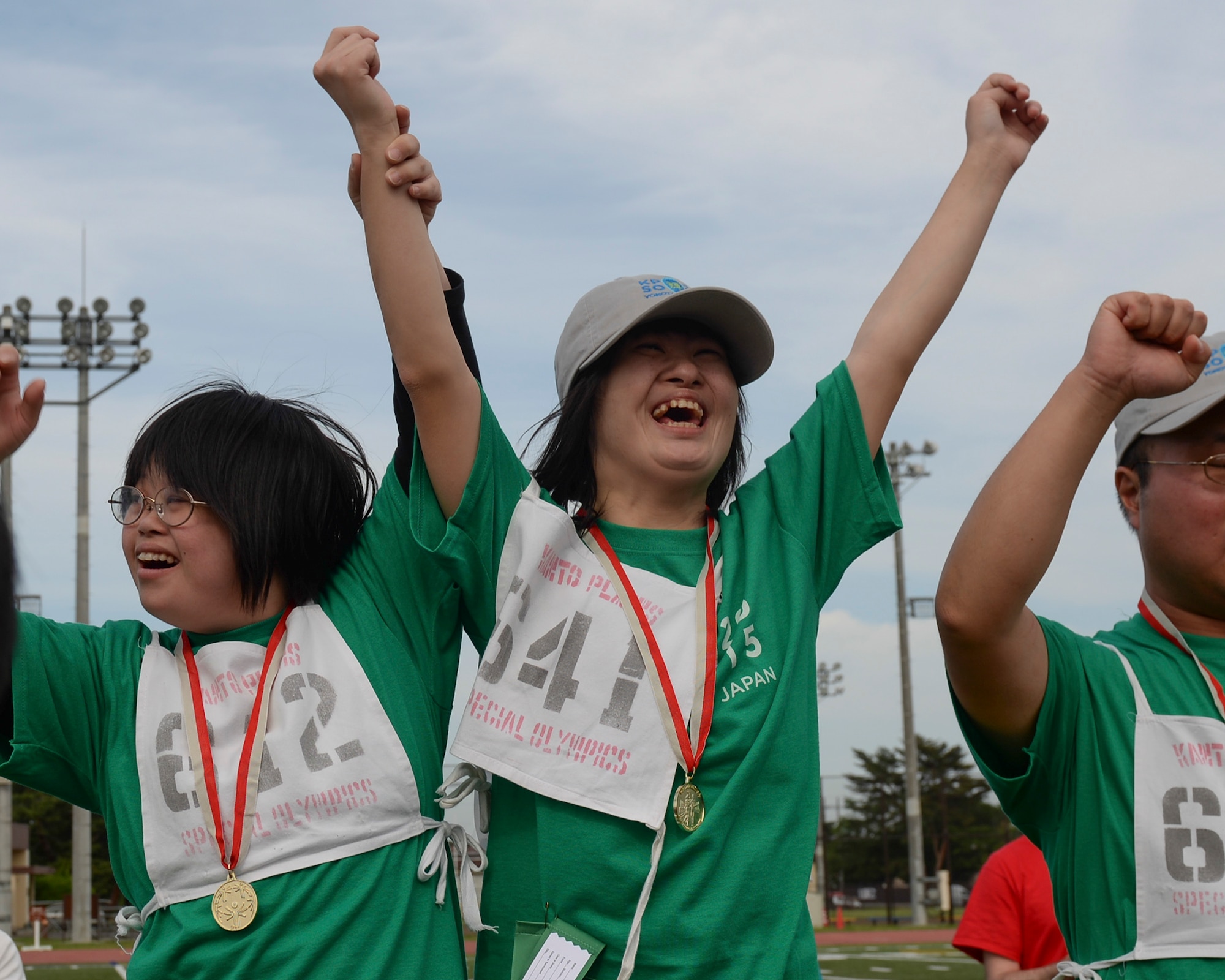 Athletes in the Kanto Plains Special Olympics celebrate after accepting achievement medals at Yokota Air Base, Japan, May 30, 2015. 159 athletes from nine schools participated in the KPSO events. (U.S. Air Force photo by Airman 1st Class Elizabeth Baker/Released)