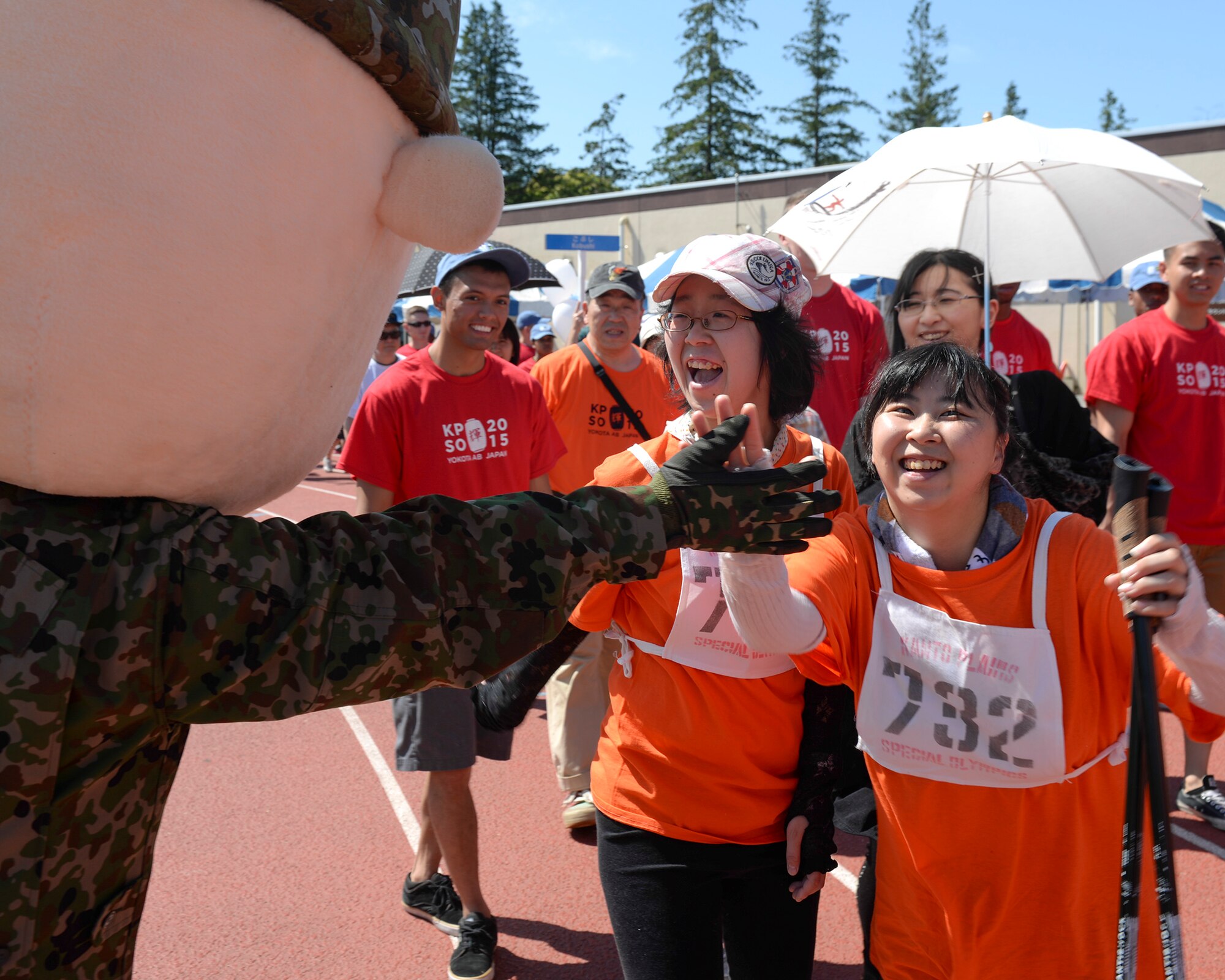 Saipon-Riku greets participants in the 36th annual Kanto Plains Special Olympics at Yokota Air Base, Japan, May 30, 2015. Saipon-Riku, who is the Japan Self-Defense Forces Saitama Recruitment Office mascot, was one of several mascots who supported the KPSO. (U.S. Air Force photo by Airman 1st Class Elizabeth Baker/Released)