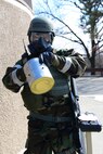 Senior Airman Jonathan Caasi, 51st Civil Engineer Squadron emergency manager, prepares to test the air for contamination during Operational Readiness Exercise Beverly Midnight 15-1 March 4, 2015, at Osan Air Base, Republic of Korea. If the M8 chemical detection paper be comes contaminated, addition tests will be done to determine if the air has nerve, blood or blister agents. (U.S. Air Force photo by Senior Airman Matthew Lancaster)