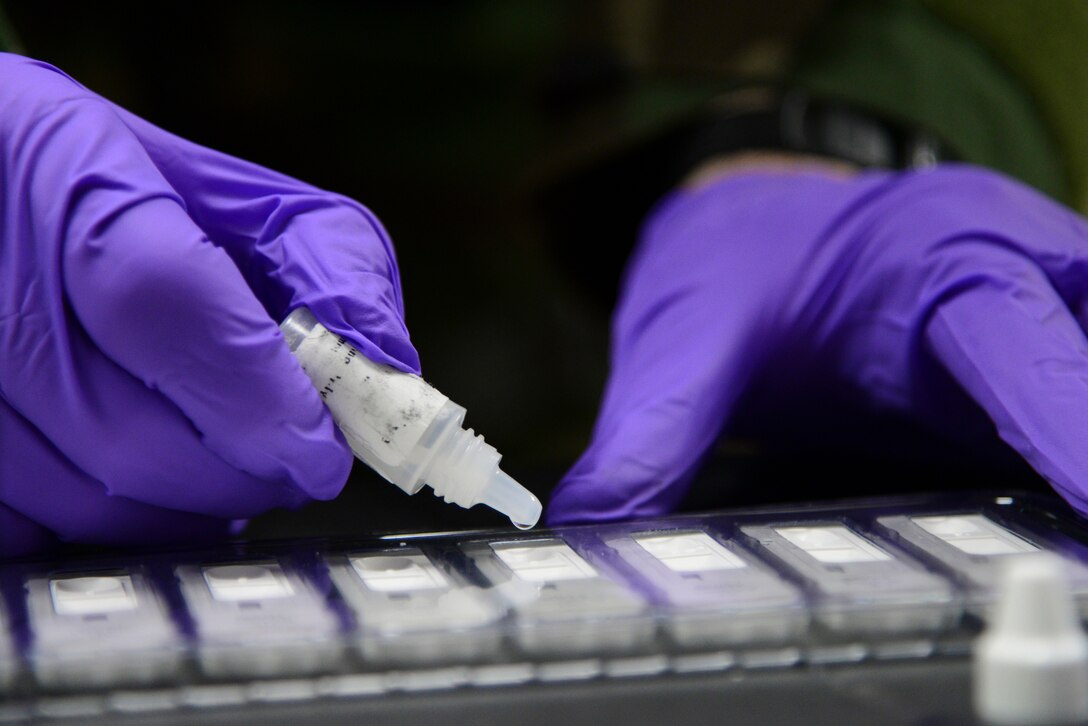 Staff Sgt. Steven Staab, 51st Aerospace Medicine Squadron NCO in charge of radiation, tests a biological sample during Operational Readiness Exercise Beverly Midnight 15-1 March 4, 2015, at Osan Air Base, Republic of Korea. The test is down to determine if the air where the sample was taken is contaminated with biological agents. (U.S. Air Force photo by Senior Airman Matthew Lancaster)