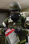 Staff Sgt. Steven Staab, 51st Aerospace Medicine Squadron NCO in charge of radiation, opens a bag with an air sample during Operational Readiness Exercise Beverly Midnight 15-1 March 4, 2015, at Osan Air Base, Republic of Korea. The sample is tested to determine if the air is containmined with biological agents. (U.S. Air Force photo by Senior Airman Matthew Lancaster)