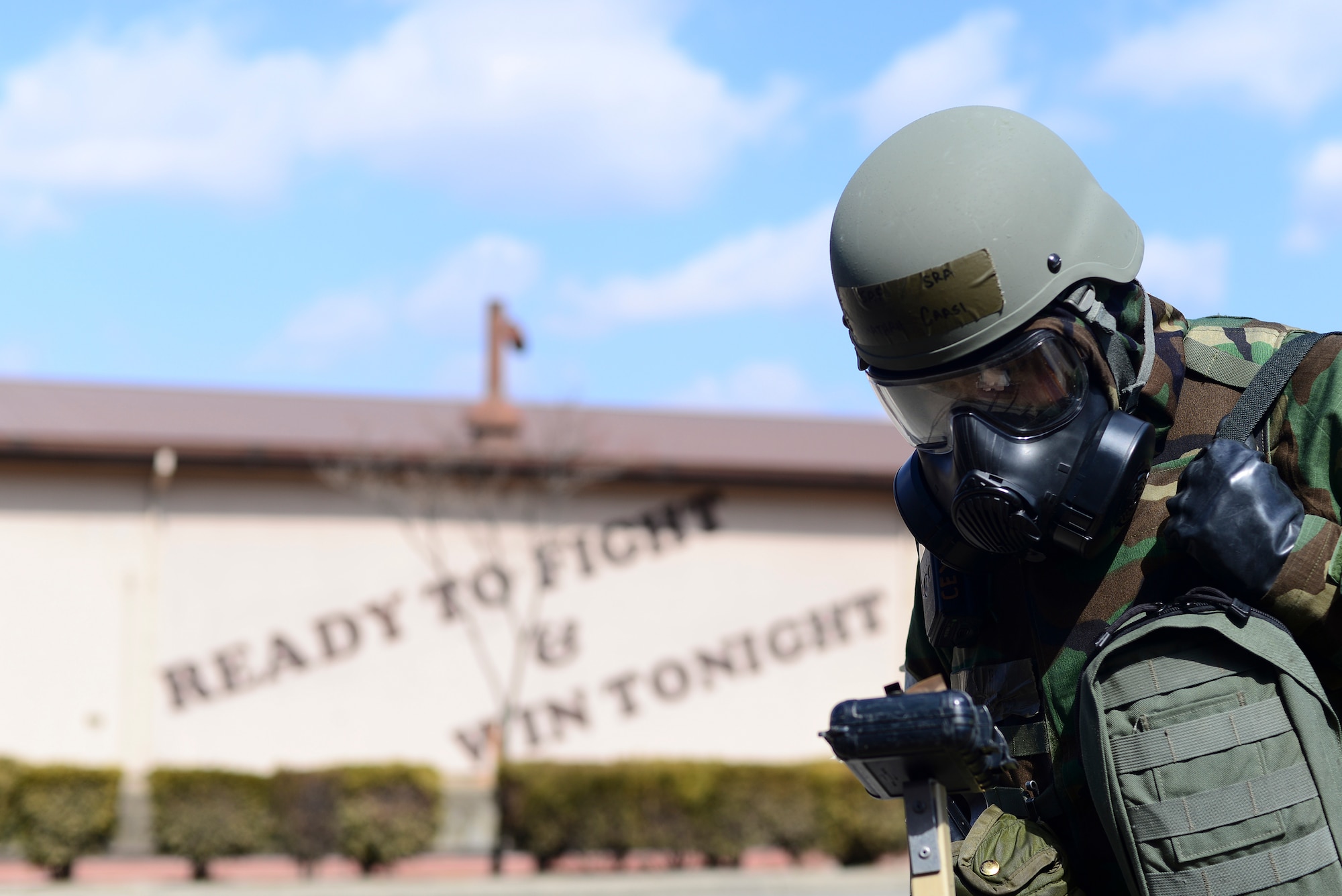 Senior Airman Jonathan Caasi, 51st Civil Engineer Squadron emergency manager, checks M8 chemical detection paper during Operational Readiness Exercise Beverly Midnight 15-1 March 4, 2015, at Osan Air Base, Republic of Korea. M8 paper is used to identify if an area is contaminated with nerve and blister chemical agents. (U.S. Air Force photo by Senior Airman Matthew Lancaster)