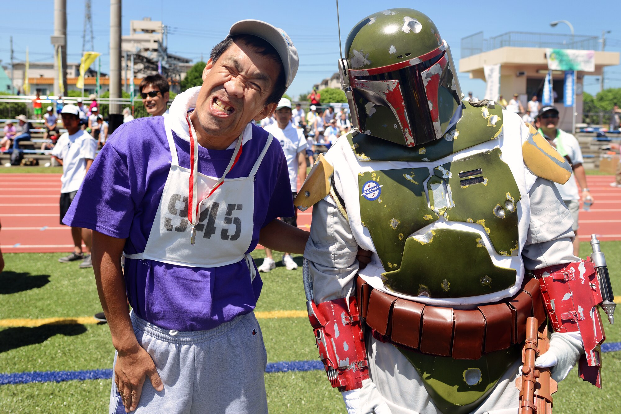A Kanto Plains Special Olympics competitor poses next to a volunteer in Star Wars regalia May 30, 2015, at Yokota Air Base, Japan. The 36th Annual KPSO provided an opportunity for competitors to have fun and build friendships. (U.S. Air Force photo by Airman 1st Class Delano Scott/Released)