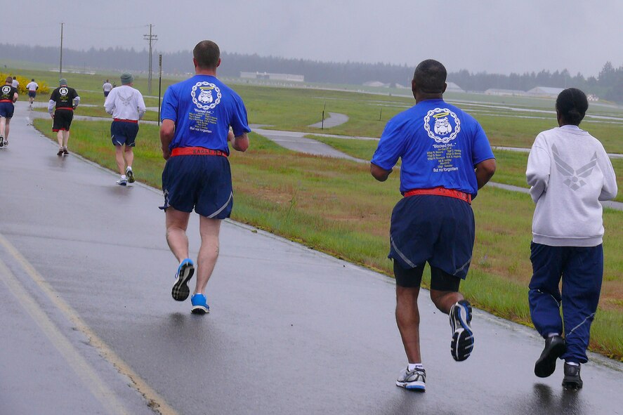 Airmen from the 62nd Aerial Port Squadron run in a memorial 5k run May 13, 2015, at Joint Base Lewis-McChord, Wash. The run helped raise money for the Fisher House Foundation in the name of fallen aerial port members. (Courtesy photo)   