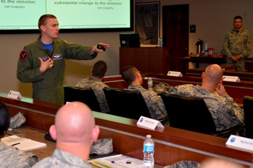 Capt. Derek Williams, Air Force Global Strike Command chief of bomber programs and operations, talks with AFGSC NCOs about the Force Improvement Program during the Striker Stripe Conference on Barksdale Air Force Base, Louisiana, May 29, 2015. The Force Improvement program is an action-oriented, field influenced program with the goal of making rapid, lasting and substantial change to the mission. (U.S. Air Force Photo/Airman 1st Class Mozer O. Da Cunha)