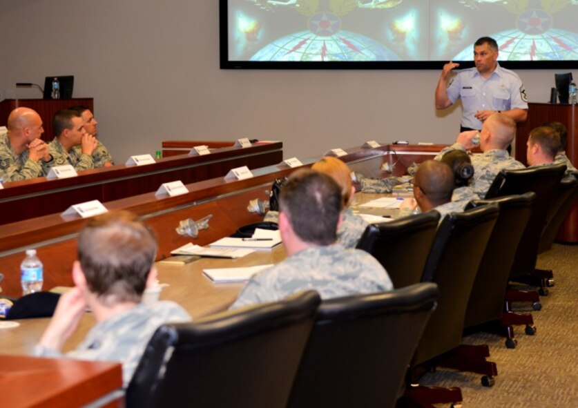 Chief Master Sgt. Tommy Mazzone, 2nd Bomb Wing command chief, talks to Air Force Global Strike Command NCOs during the Striker Stripe conference on Barksdale Air Force Base, Louisiana, May 29, 2015. Mazzone gave leadership advice and guidance on a path of success to the rank of chief master sergeant. (U.S. Air Force Photo/Airman 1st Class Mozer O. Da Cunha)