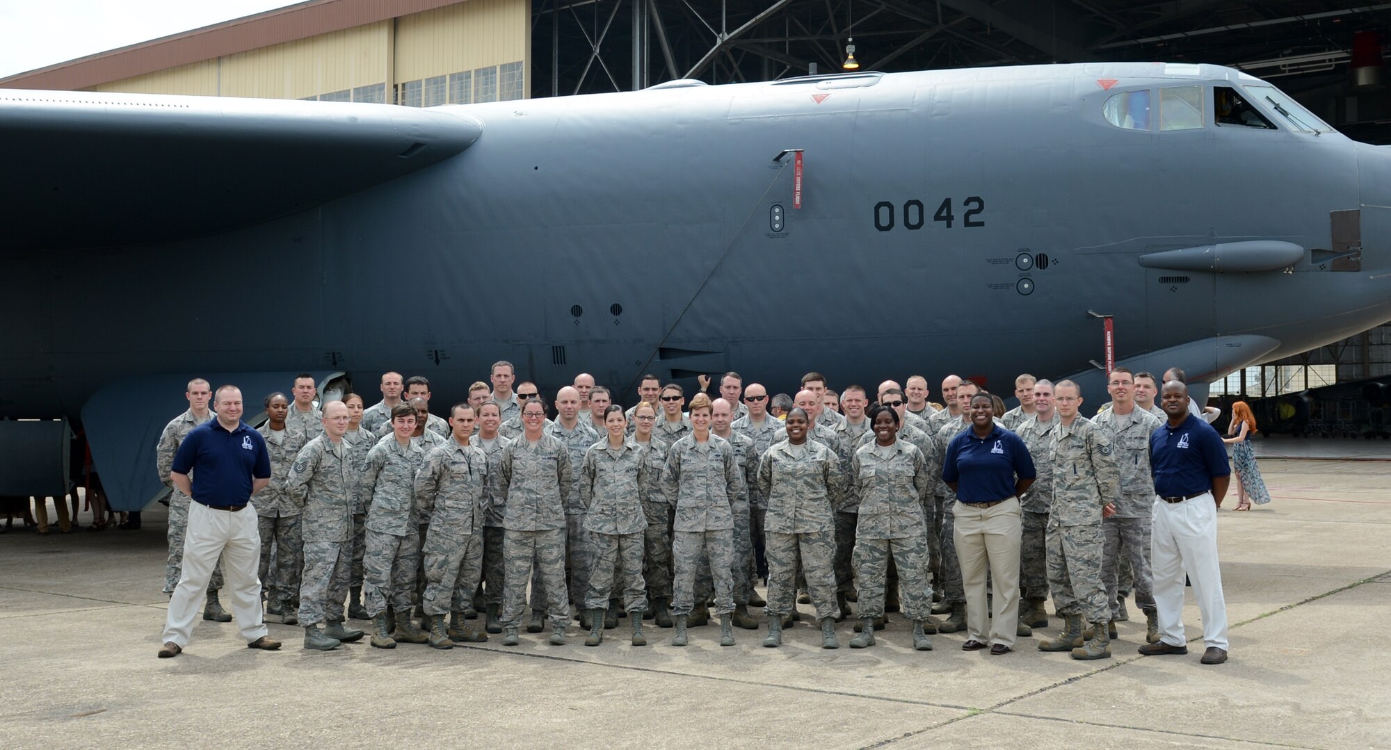 Attendees of the Striker Stripe Conference pose for a group photo in front of a B-52H Stratofortress on Barksdale Air Force Base, Louisiana, May 29, 2015. Striker Stripe is designed to give Airmen tools to make them more efficient, which they then take back to their units. (U.S. Air Force photo/Senior Airman Benjamin Gonsier)