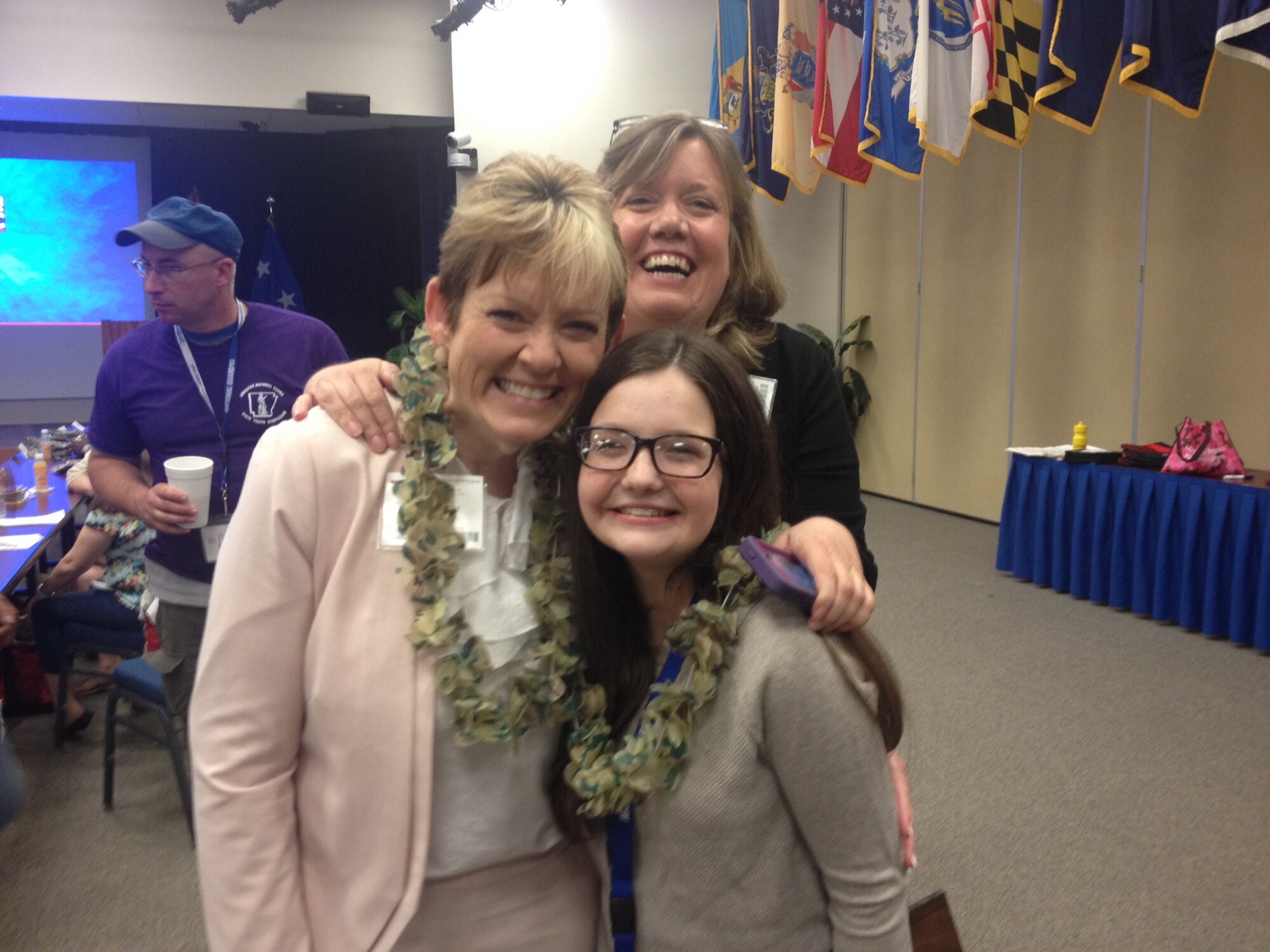 From left, Shirley Bearden, Michelle Pike, 188th Wing Airman and Family Readiness Program Manager, and Savannah Sosebee pose for a photo May 16, 2015 at Camp Robinson, North Little Rock, Ark. Bearden won the 2015 Arkansas National Guard Volunteer Award and the National Guard Bureau Region 6 Family Programs award and Sosebee won the 2015 Arkansas National Guard Youth Volunteer Award. (Courtesy photo by Maj. Kimberly Keizer/Released)