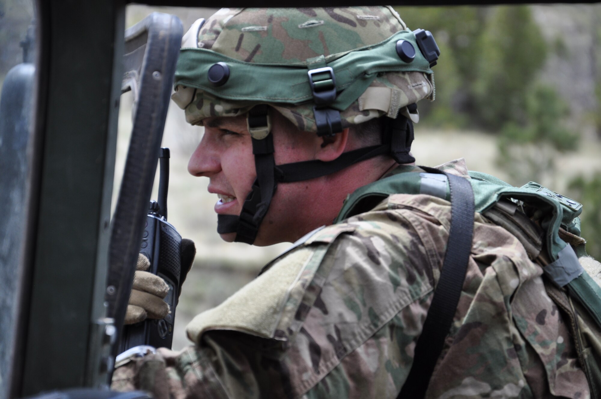 Master Sgt. Joseph Anderson, NCO-in-charge of the 791st Missile Security Forces Squadron’s Convoy Response Force, coordinates team movements during a Road Warrior exercise scenario at Camp Guernsey, Wyoming, May 18, 2015. An annual AFGSC event hosted by 20th Air Force’s 620th Ground Combat Training Squadron, Road Warrior evaluates the effectiveness of response force skills throughout a variety of scenarios. (U.S. Air Force photo by Airman 1st Class Kelly O'Connor/Released)