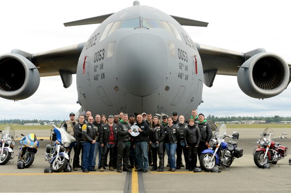 Members of the Green Knights Military Motorcycle Club Chapter 3 pose for a picture, May 23, 2015, at Joint Base Lewis-McChord, Wash. The club focuses on motorcycle safety and mentorship to teach motorcycle riders of all skill levels. (U.S. Air Force photo/Airman 1st Class Keoni Chavarria)