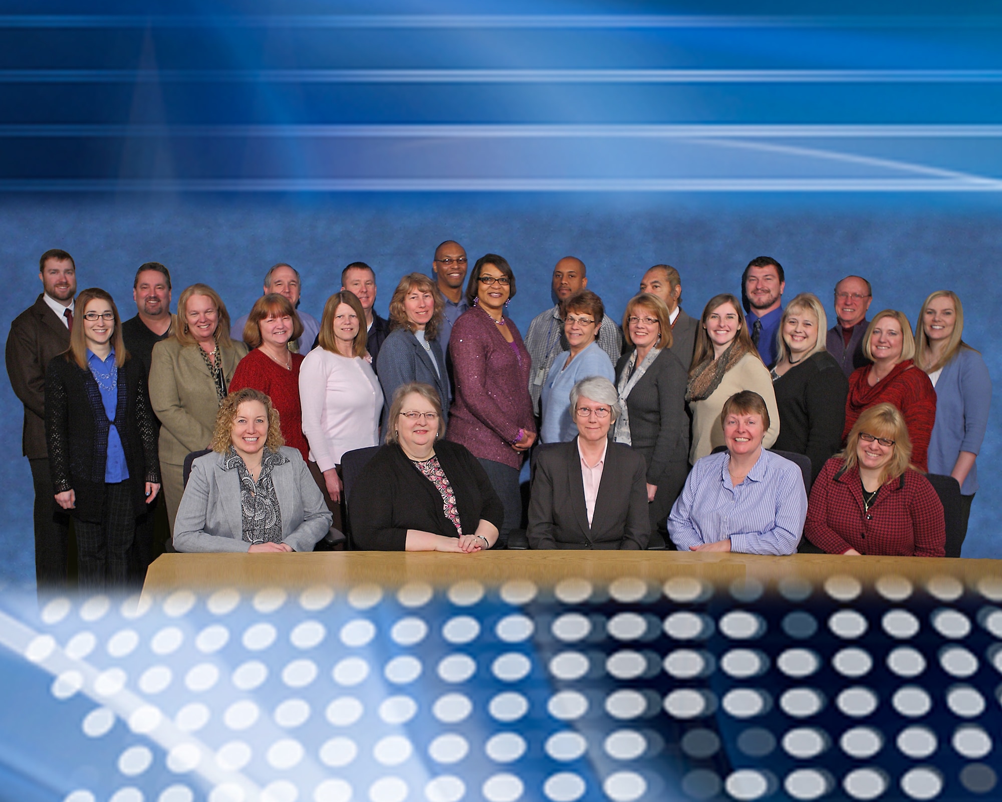 Pam Henson, pictured with the Financial Management team from AFRL Headquarters, says she will miss the people of AFRL the most, following her retirement June 2, 2015. (U.S. Air Force photo illustration by Jeremy Patton)