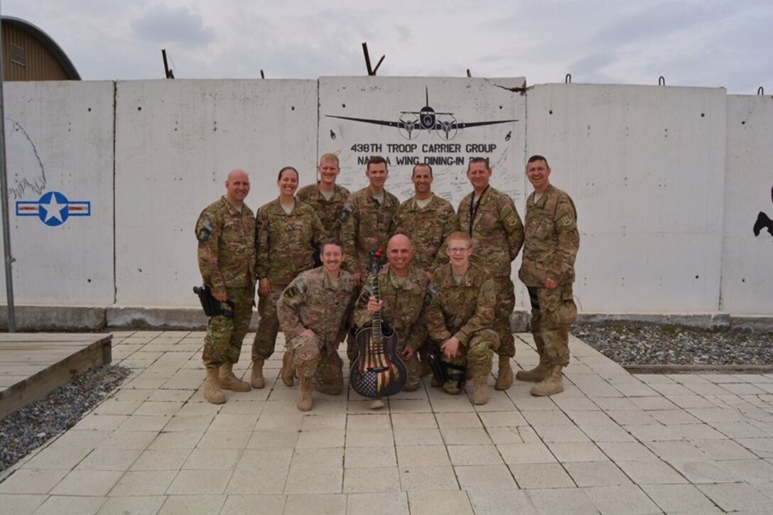 The AFCENT Band Nighthawk poses for a photo after an impromptu jam session at a forward-operating base near Kabul, Afghanistan. (U.S. Air Force photo/released)
