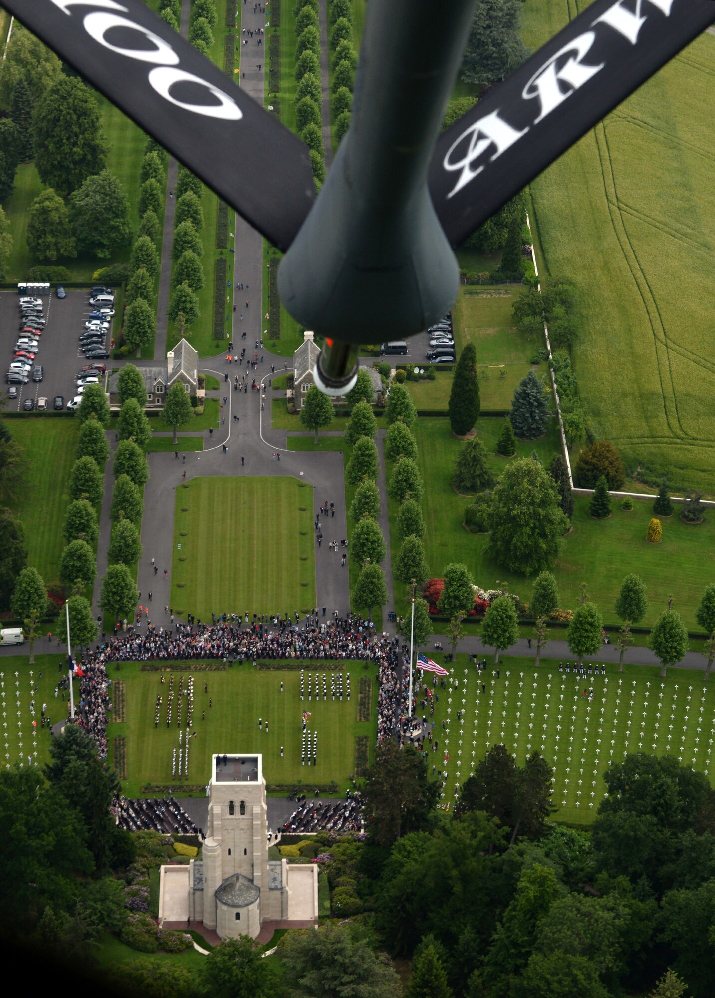 A 100th Air Refueling Wing KC-135 Stratotanker conducts a flyover during a Memorial Day ceremony above Aisne-Marne American Cemetery and Memorial, May 31, 2015, in Belleau, France. The extended memorial service was held six days after Memorial Day to accommodate multiple service components who participated in the event. The cemetery spans across more than 42 acres and contains the graves of 2,289 service members, most of whom lost their lives in the summer of 1918. (U.S. Air Force photo/Tech. Sgt. Krystie Martinez/Released)