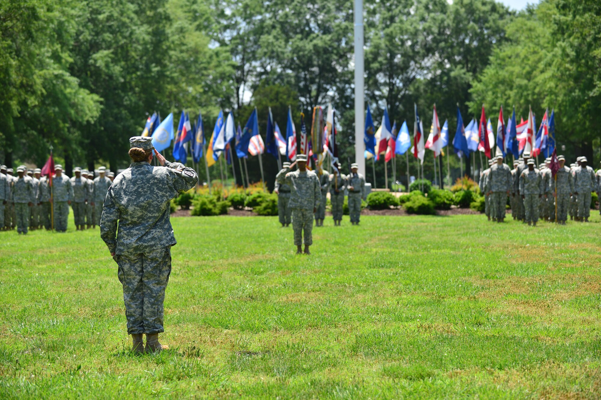 U.S. Army Lt. Col. Heidi Mon, McDonald Army Health Center commander, takes command of her unit during her assumption of command ceremony at Fort Eustis, Va., May 28, 2015. Mon assumed command of the MCAHC, which provides care for more than 50,000 patients. (U.S. Air Force photo by Staff Sgt. Natasha Stannard/Released)