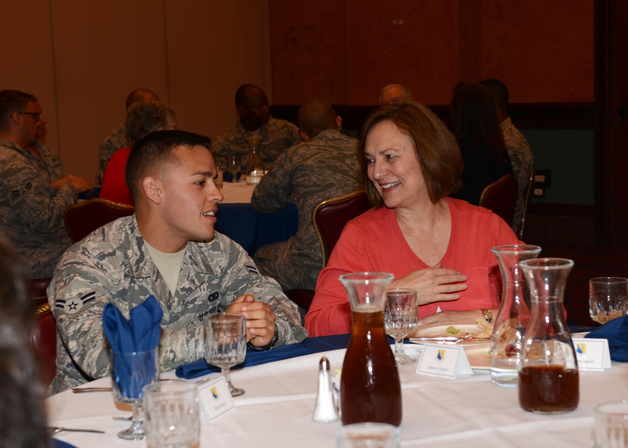 Airman 1st Class Alan Barraza, 31st Security Forces Squadron knowledge operations apprentice, speaks to Sen. Deb Fischer of Nebraska, during a lunch event, May 29, 2015, at Aviano Air Base, Italy. Team Aviano members asked questions and learned more about senators from Texas, Wyoming, Nebraska and Alabama, and a representative from Texas, while the during a visit to Aviano Air Base. (U.S. Air Force photo by Airman 1st Class Deana Heitzman/Released) 