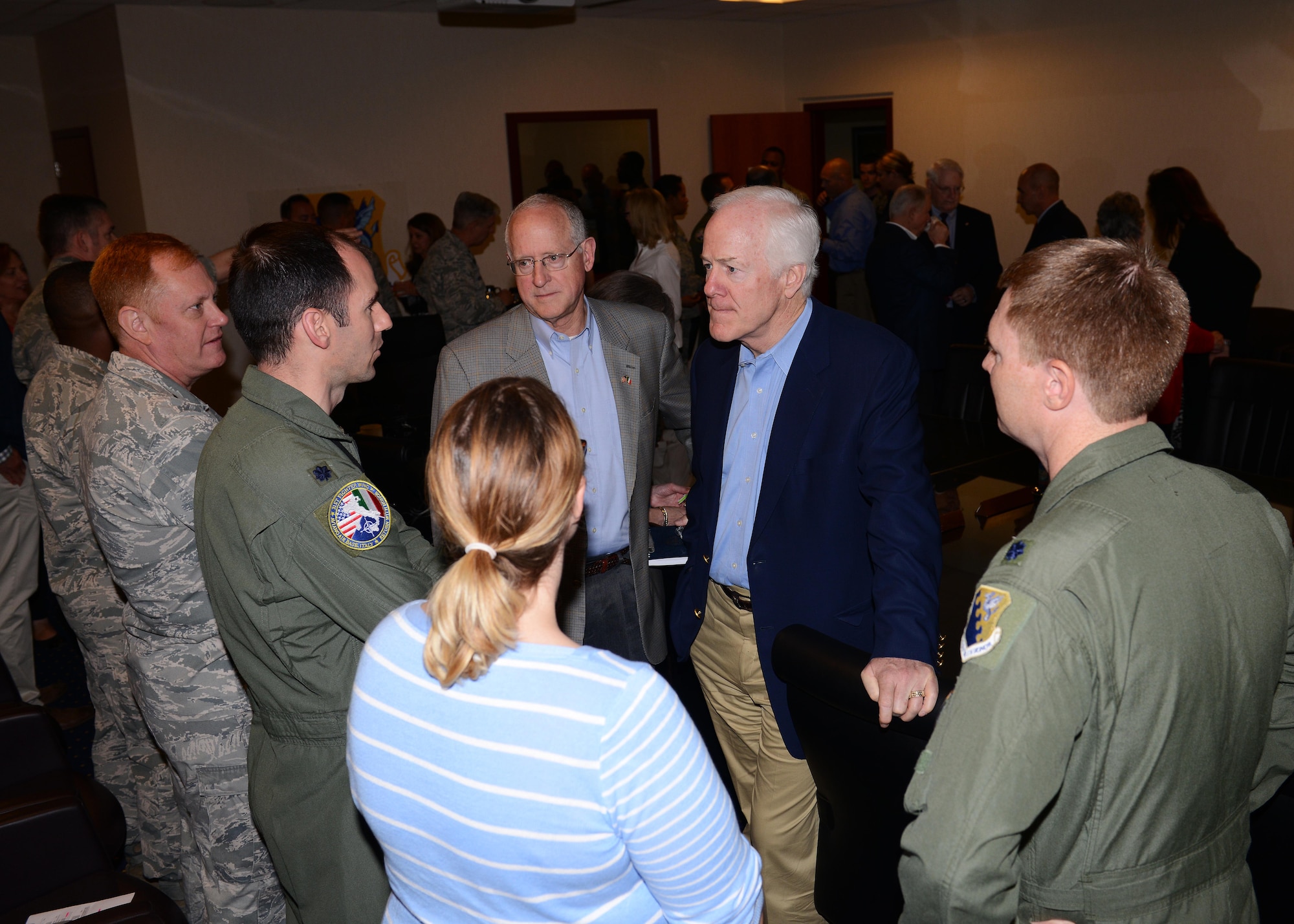 Rep. Michael Conaway and Sen. John Cornyn of Texas speak with Team Aviano members, May 29, 2015, at Aviano Air Base, Italy. During the visit, senators from Texas, Wyoming, Nebraska and Alabama and a representative from Texas received a mission brief and took time to meet with Airmen from their respective states during a luncheon. (U.S. Air Force photo by Airman 1st Class Deana Heitzman/Released)