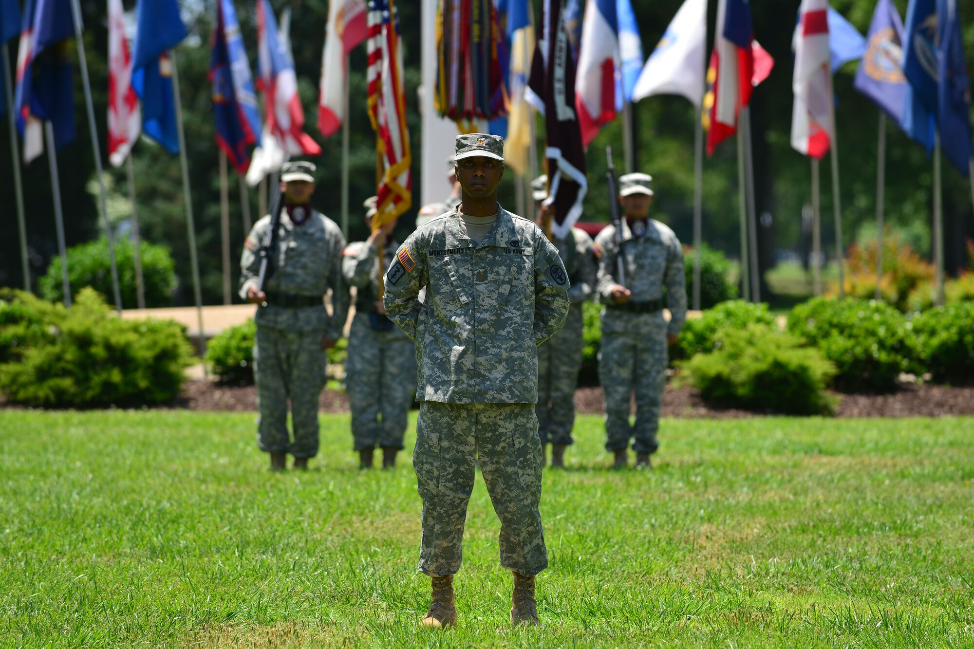 U.S. Army Maj. Terrance Montgomery, McDonald Army Health Center chief financial officer, stands at parade rest in front of the Fort Eustis Color Guard during an assumption of command ceremony at Fort Eustis, Va., May 28, 2015. Montgomery commanded the color guard and troop formations during the ceremony. (U.S. Air Force photo by Staff Sgt. Natasha Stannard/Released) 
