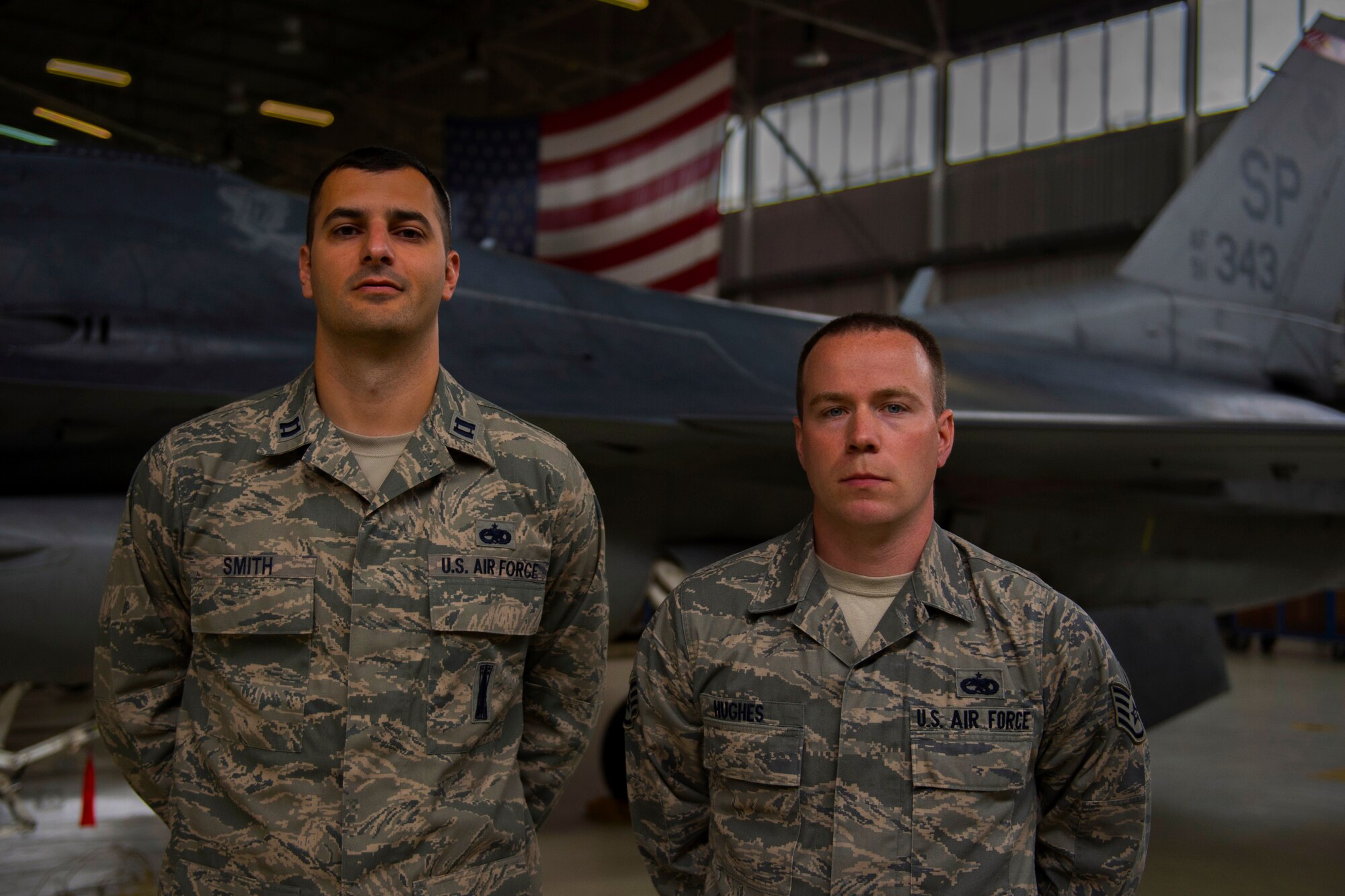 U.S. Air Force Capt. Warren Smith, 52nd Equipment Maintenance Squadron operations officer, left, and U.S. Air Force Staff Sgt. Todd Hughes, 52nd EMS phase inspection floor chief, stand in front of an F-16 Fighting Falcon fighter aircraft at Spangdahlem Air Base, Germany, June 1, 2015. Starting this fall, Smith and Hughes will join the U.S. Air Force Air Demonstration Squadron, commonly known as the Thunderbirds, at Nellis Air Force Base, Nev. (U.S. Air Force photo by Airman 1st Class Luke Kitterman/Released) 