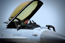 Republic of Korean Air Force Capt. Mimgyu Han, 123rd Fighter Squadron F-16 Fighting Falcon pilot, prepares to climb out of his assigned aircraft as part of Buddy Wing at Kunsan Air Base, Republic of Korea, June 1, 2015. In an effort to enhance interoperability, Buddy Wing allows pilots an opportunity to exchange ideas and practice combined tactics in order to fight and fly as one Allied force. (U.S. Air Force photo by Staff Sgt. Nick Wilson/Released)  