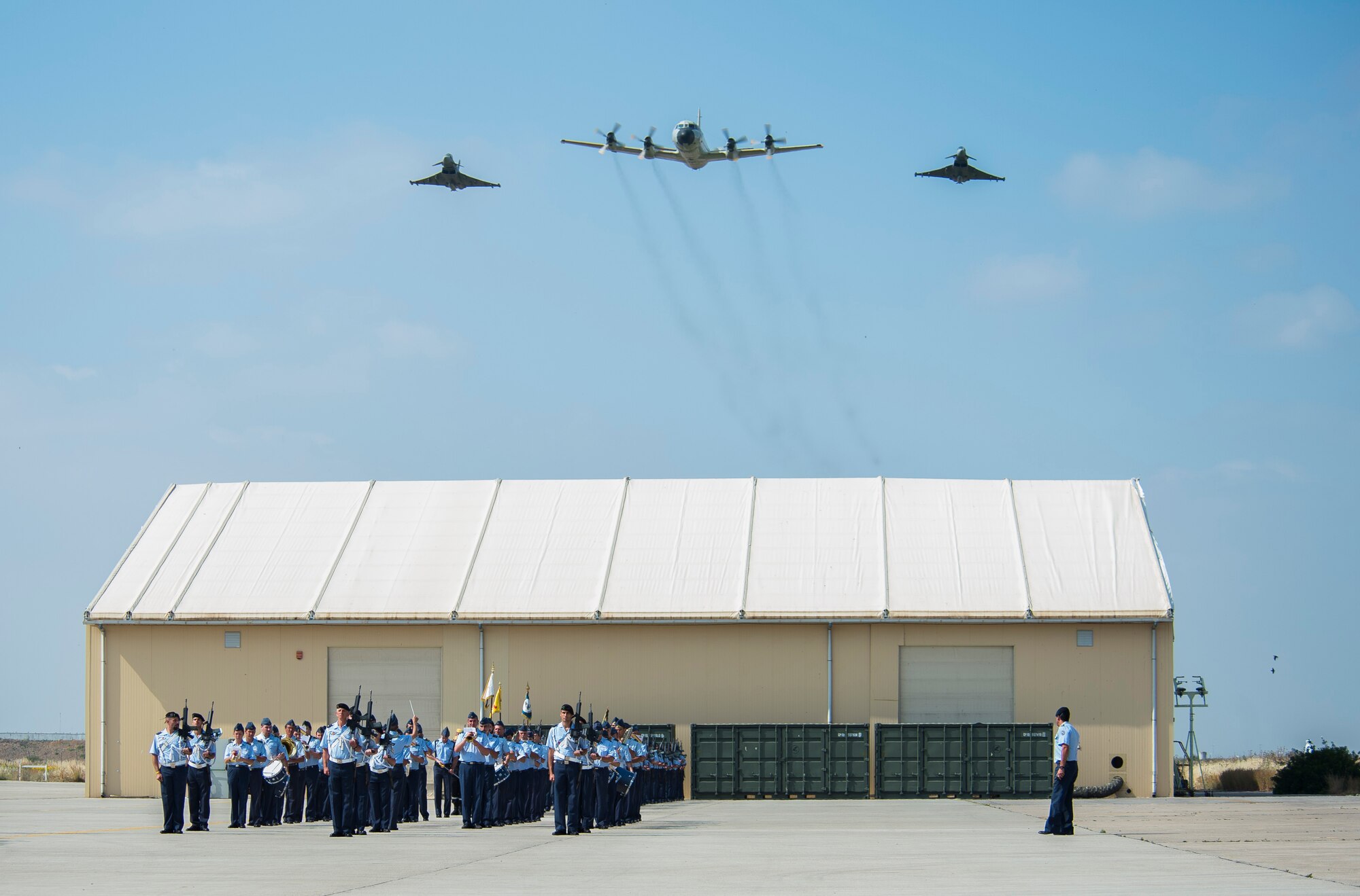 Members of the Spanish Air Force perform a pass and review during an open house Ma, 30, 2015, at Morón Air Base, Spain. The two-day event was held to celebrate Morón’s 75th anniversary. Participating units included the Spanish Air Force, U.S. Air Force 496th Air Base Squadron and Marine Corps Special-Purpose Marine Air-Ground Task Force Crisis Response-Africa. Visitors had the opportunity to see static displays from both countries’ armed forces, such as the Eurofighter Typhoon, P-3 Orion and MV-22B Osprey. (U.S. Air Force photo/Senior Airman Damon Kasberg)
