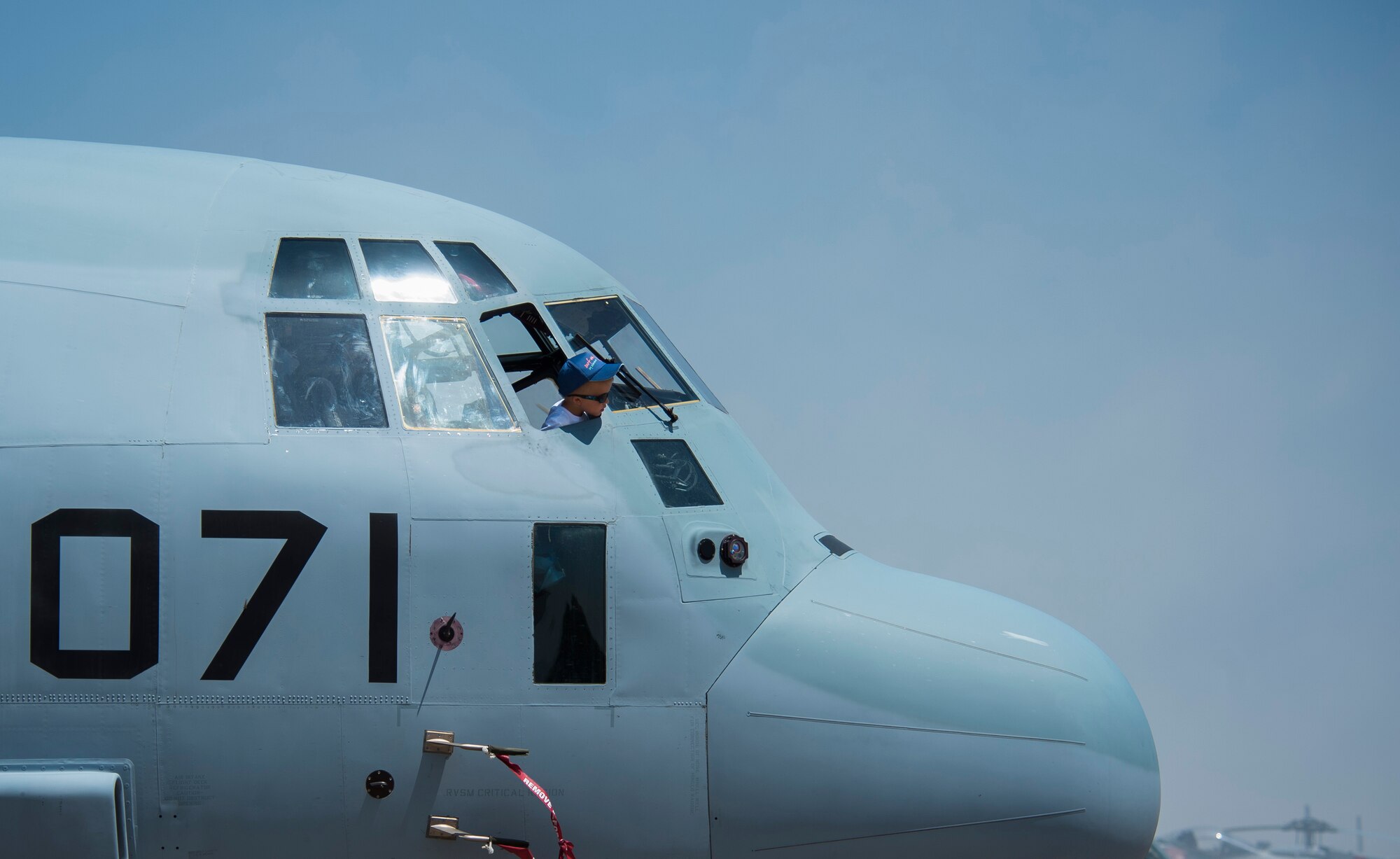 A child looks out the window of a Marine KC-130J Hercules while attending an open house May 30, 2015, at Morón Air Base, Spain. The two-day event was held to celebrate Morón’s 75th anniversary. Morón hosts U.S. Air Force and Marines units, and supports operations throughout Europe, Africa and Central Asia. (U.S. Air Force photo/Senior Airman Damon Kasberg)
