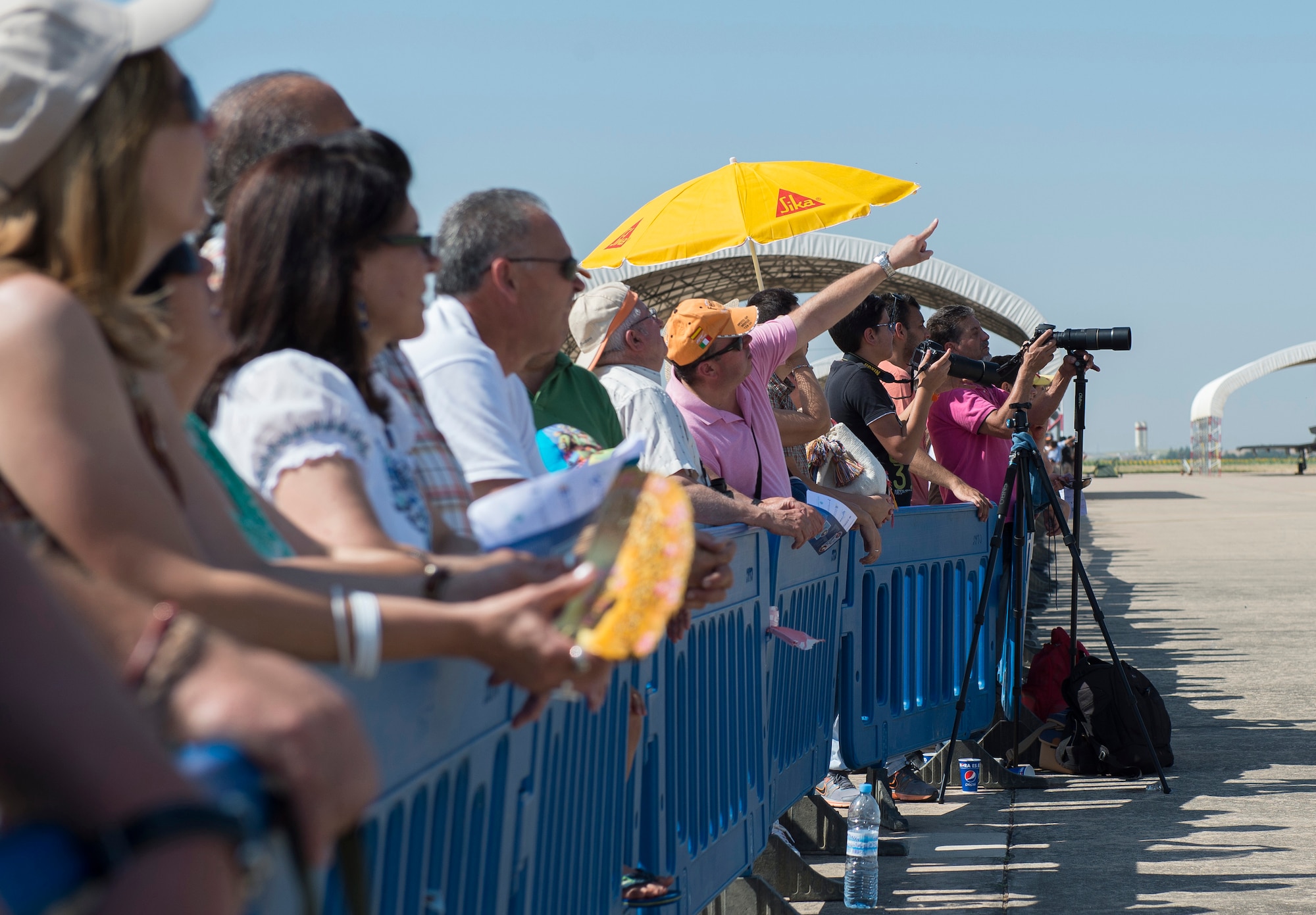 Attendees of an open house watch aerial demonstrations May 31, 2015, at Morón Air Base, Spain. The two-day event was held to celebrate Morón’s 75th anniversary. Highlights included shows from the Spanish Air Forces’ Patrulla Águila, Casa C-101 Aviojets demonstration team and Patrulla ASPA, EC-120 helicopter aerobatic display team. (U.S. Air Force photo/Senior Airman Damon Kasberg)
