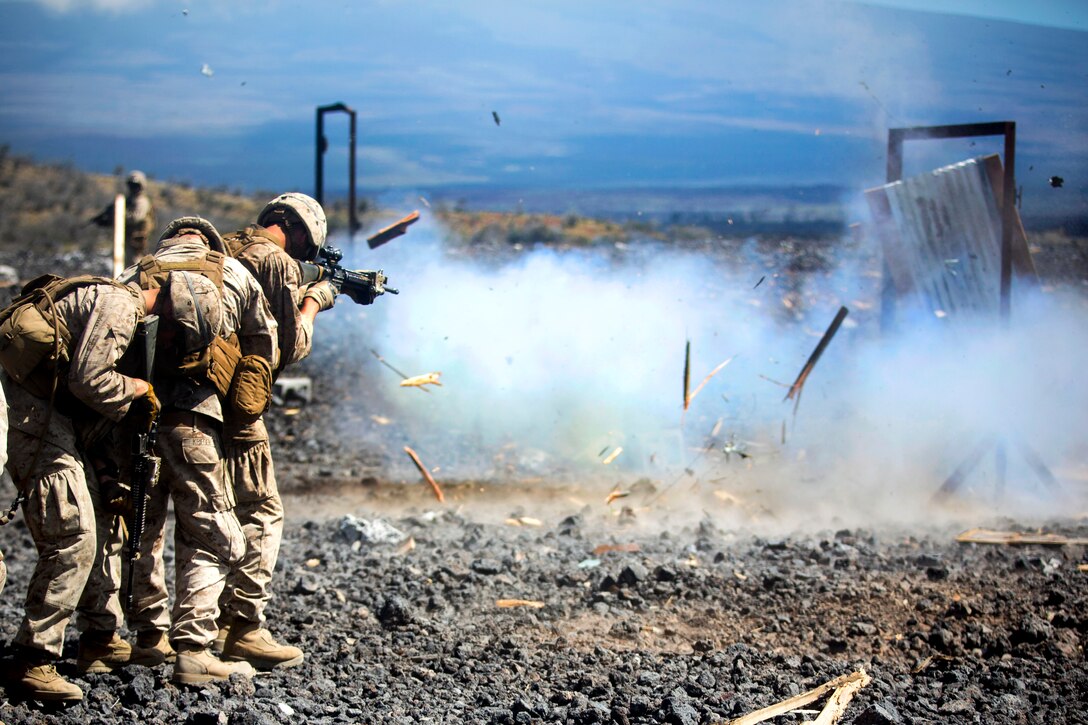 Marines line up for a door-breaching exercise using a water charge during Operation Lava Viper at Pohakuloa Training Area, Hawaii, May 28, 2015.
