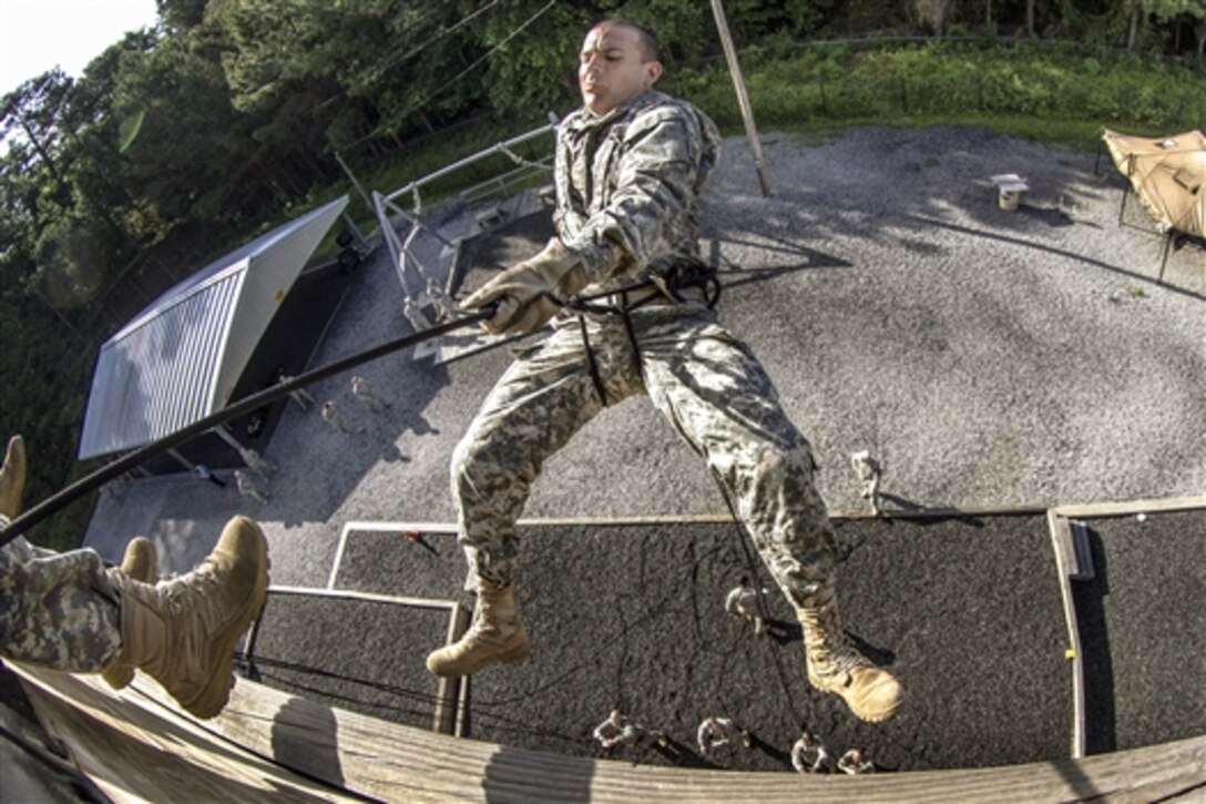 A chaplain candidate in a leaders course rappels during certification on Victory Tower as part of two weeks of annual training on Fort Jackson, S.C., May 29, 2015.