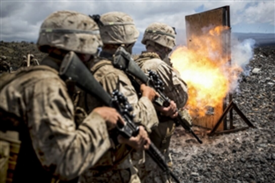 Marines line up for a door-breaching exercise using a donut charge during Operation Lava Viper at Pohakuloa Training Area, Hawaii, May 28, 2015. The Marines are combat engineers assigned to Charlie Company, 1st Battalion, 3rd Marine Regiment.