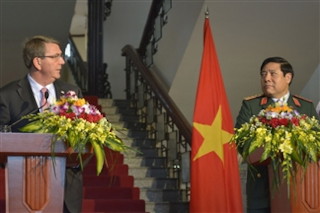 Defense Secretary Ash Carter, left, and Vietnamese Defense Minister General Phung Quang Thanh, hold a press conference in Hanoi, Vietnam, June 1, 2015. Carter is on a 10-day trip to the Asia-Pacific to meet with partner nations and affirm U.S. commitment to the region.