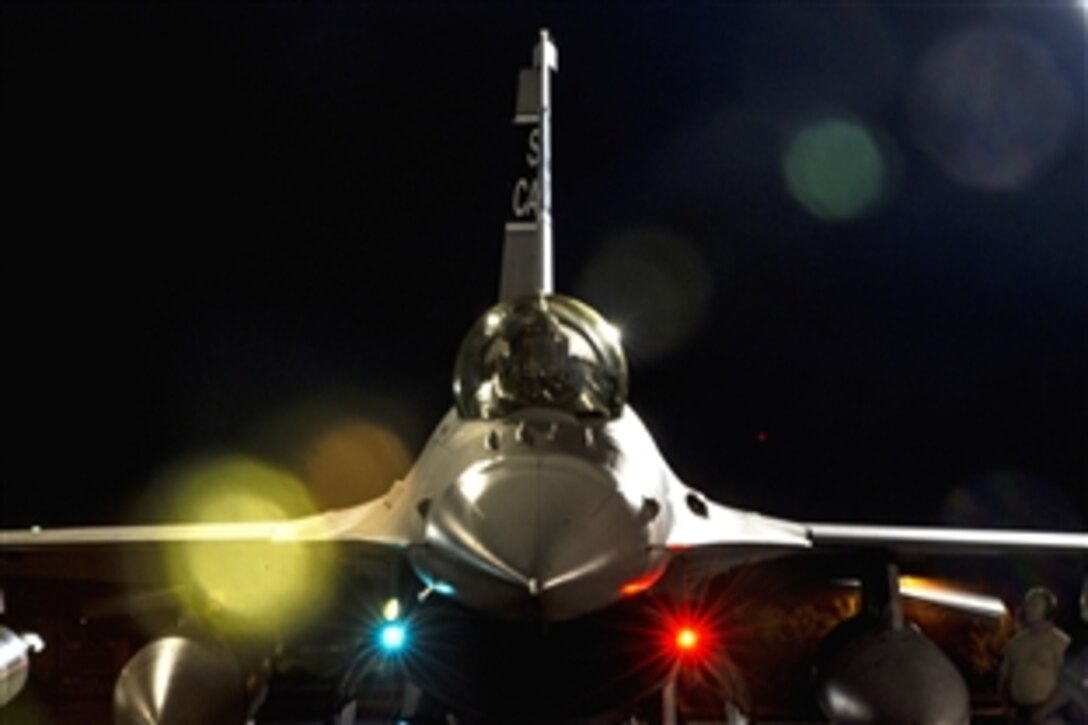 A South Carolina Air National Guard F-16 sits on the ramp before departing to Lask Air Base, Poland, May 28, 2015. The 169th Fighter Wing on McEntire Joint National Guard Base, S.C., deployed F-16 Fighting Falcons to support Operation Atlantic Resolve during training that included pairing U.S. F-16 pilots and maintenance crews with their Polish counterparts.