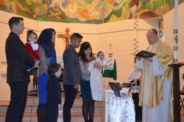 Chaplain Longe performs baptism while deployed to Italy.