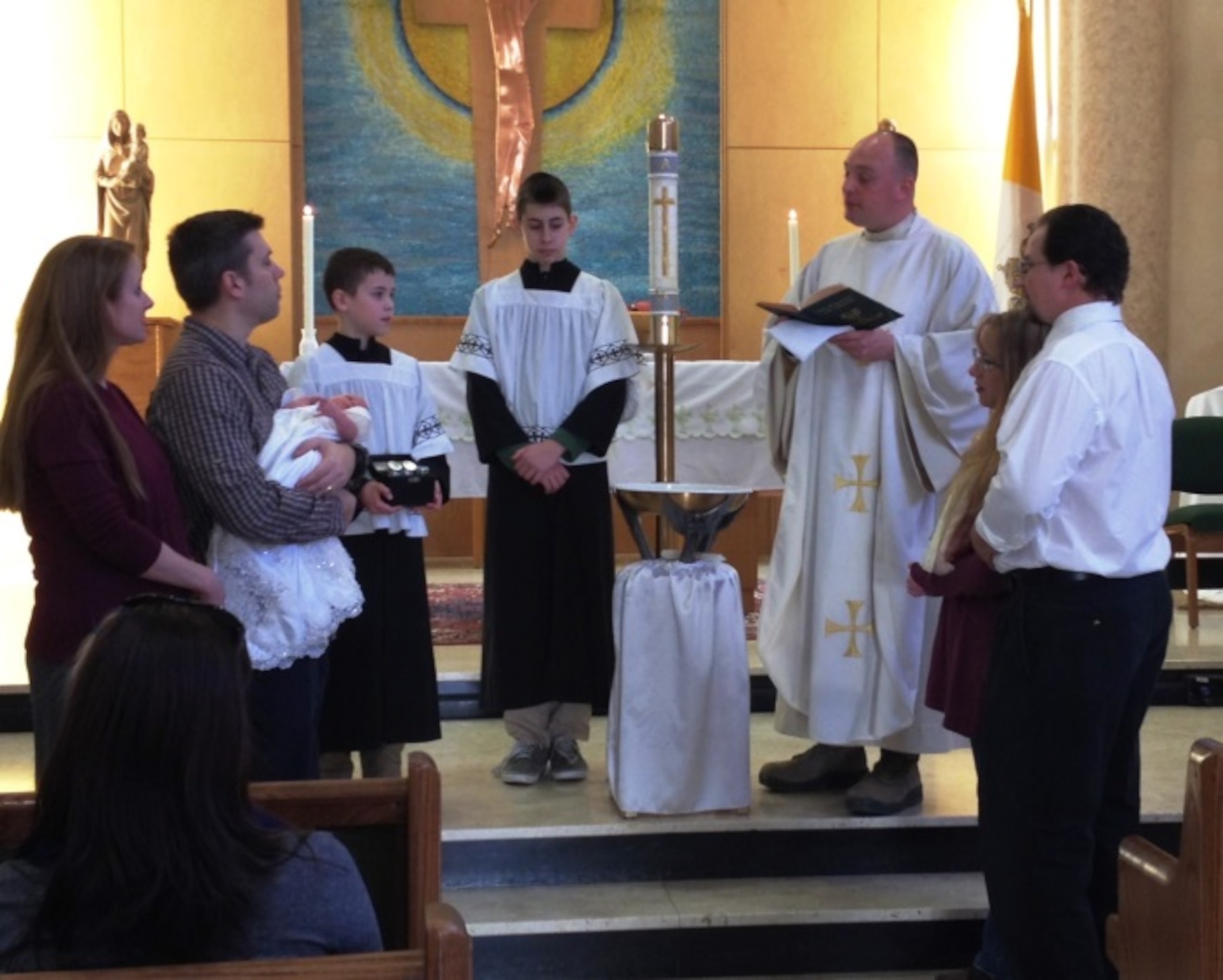 Chaplain Longe prepares for a baptism while deployed to Northern Italy.